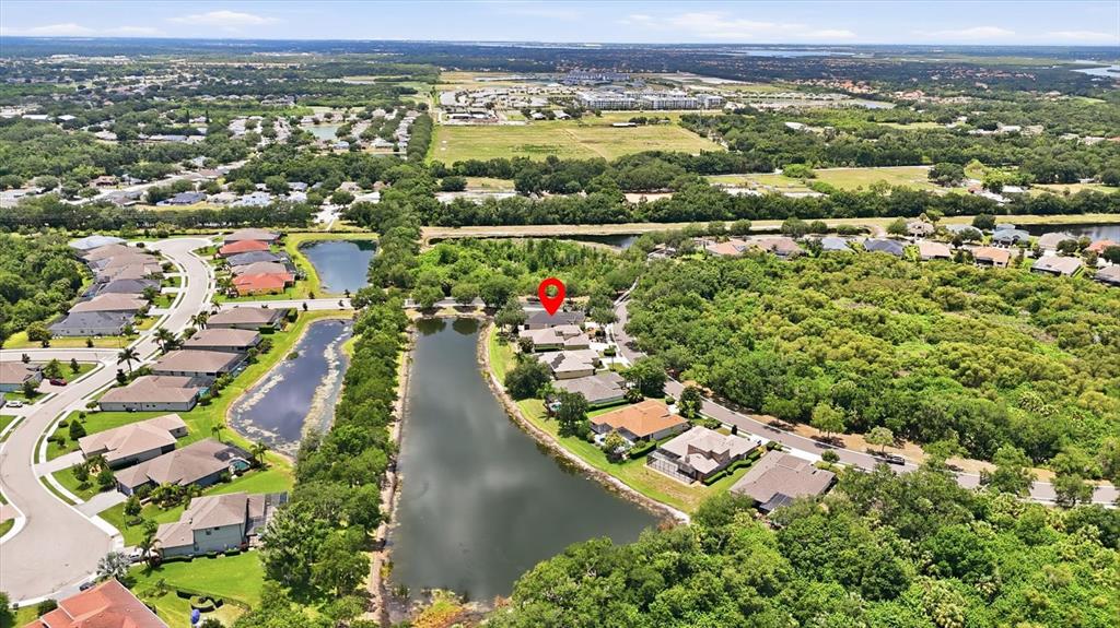 428 Snapdragon Loop Bradenton, FL 34212 - Photo 33 of 33 an aerial view of residential houses with outdoor space