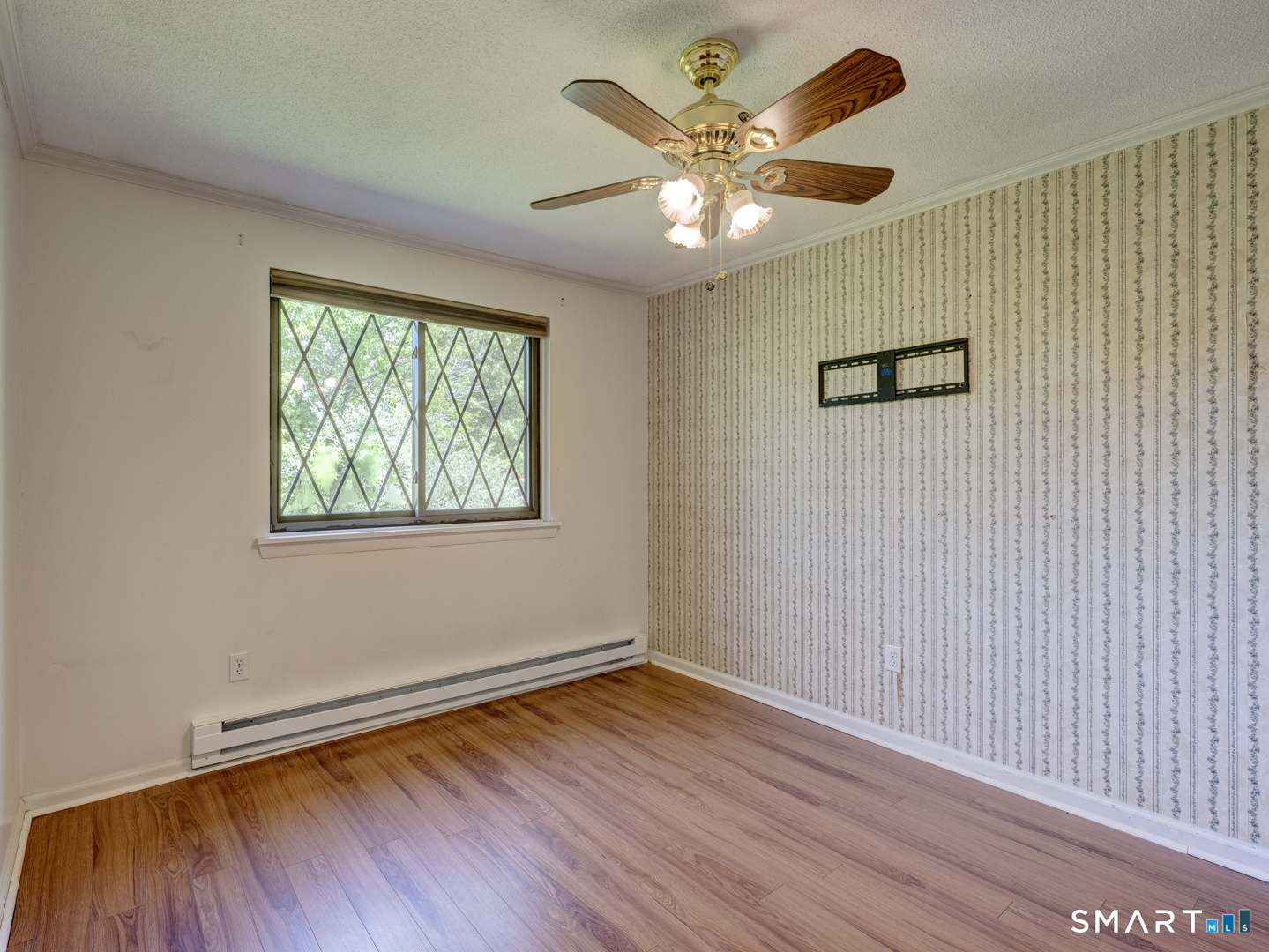 2 Branch Road, Unit 2C Thomaston, CT 06787 - Photo 18 of 26 an empty room with wooden floor chandelier fan and windows