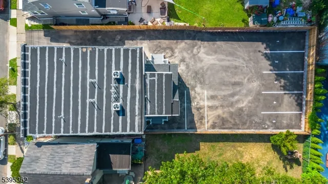 a view of swimming pool with a yard and plants