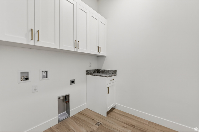 2862 South Mountain Rnch Road Cedar City, UT 84720 - Photo 21 of 64 Laundry area featuring white shaker cabinetry, gold-tone hardware, a dark granite countertop, and wood-finish flooring