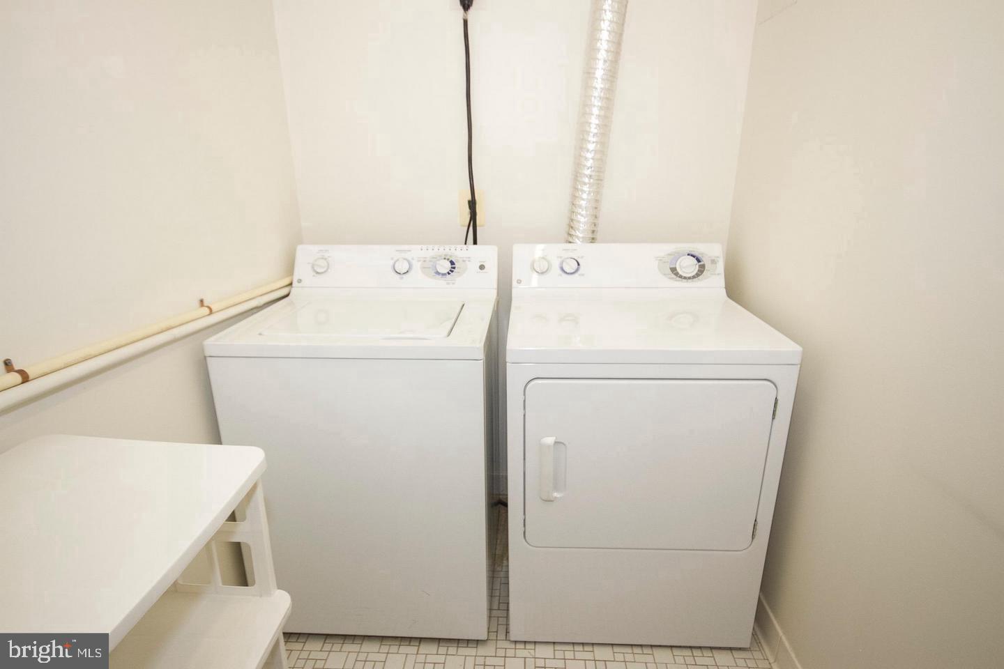 7202 Rockland Hills Drive, Unit 110 Baltimore, MD 21209 - Photo 12 of 13 a utility room with dryer and washer