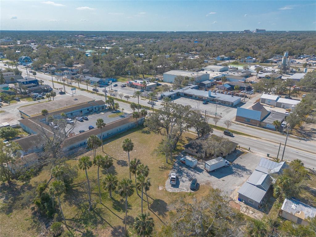 629 North Ridgewood Avenue Daytona Beach, FL 32114 - Photo 5 of 10 an aerial view of residential houses with outdoor space