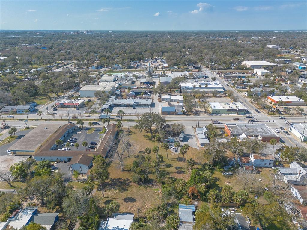 629 North Ridgewood Avenue Daytona Beach, FL 32114 - Photo 6 of 10 an aerial view of residential houses with outdoor space