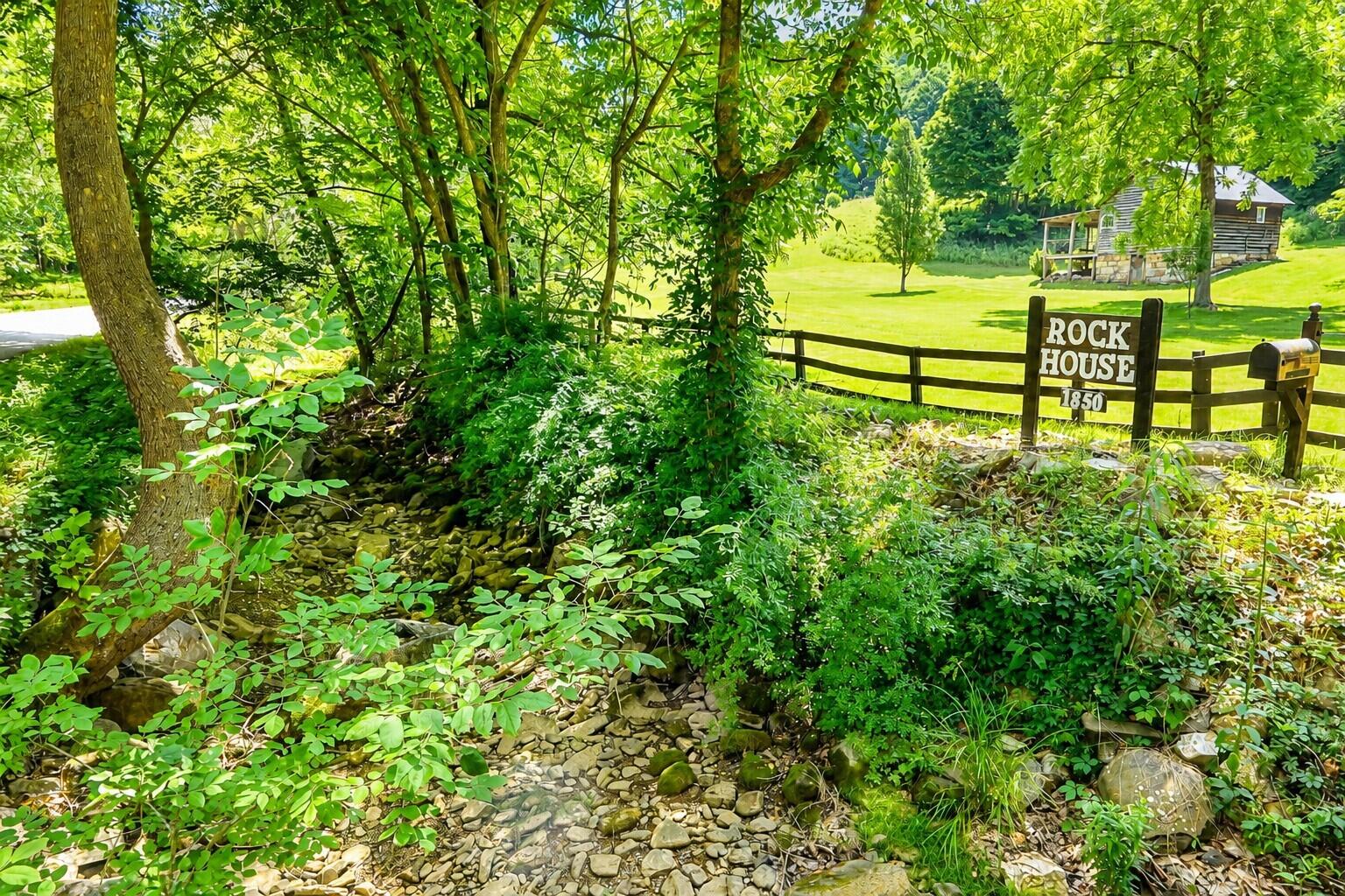 4407 Rich Patch Road Covington, VA 24426 - Photo 6 of 63 a view of a garden with a bench