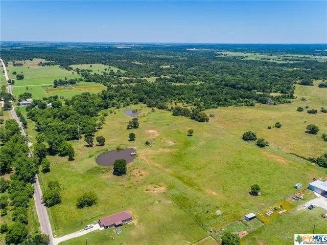 a view of a swimming pool and an outdoor space