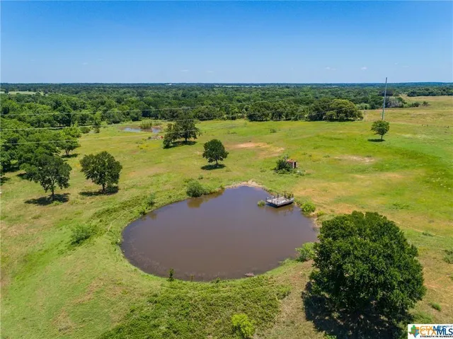 a view of a lake with a yard
