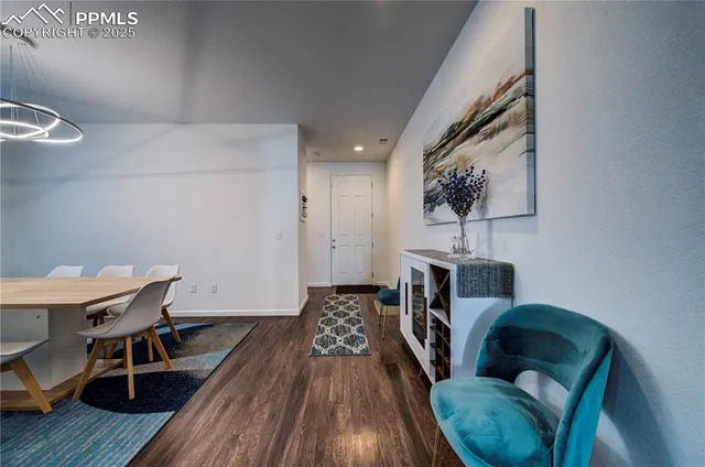 a view of a livingroom with furniture and wooden floor