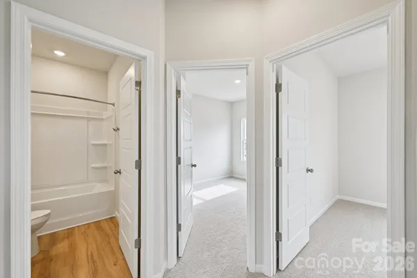 a bathroom with a tub and shower