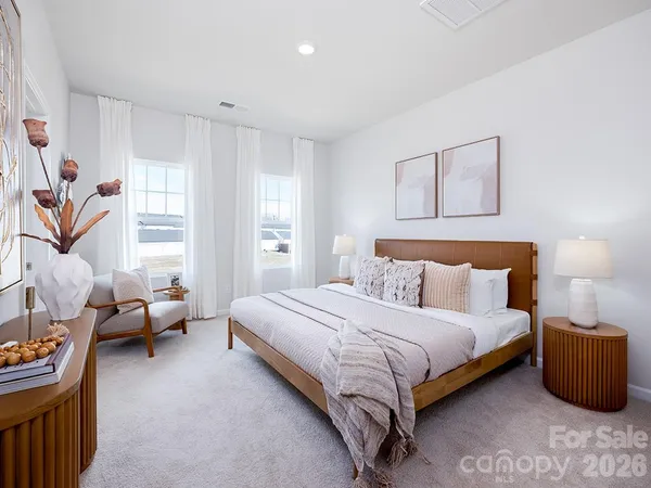 a bedroom with a bed and furniture