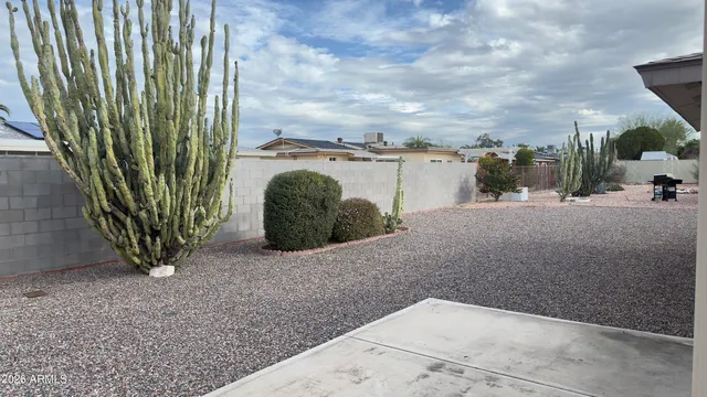 an aerial view of a house with yard