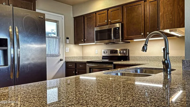a bathroom with a sink a vanity and a mirror