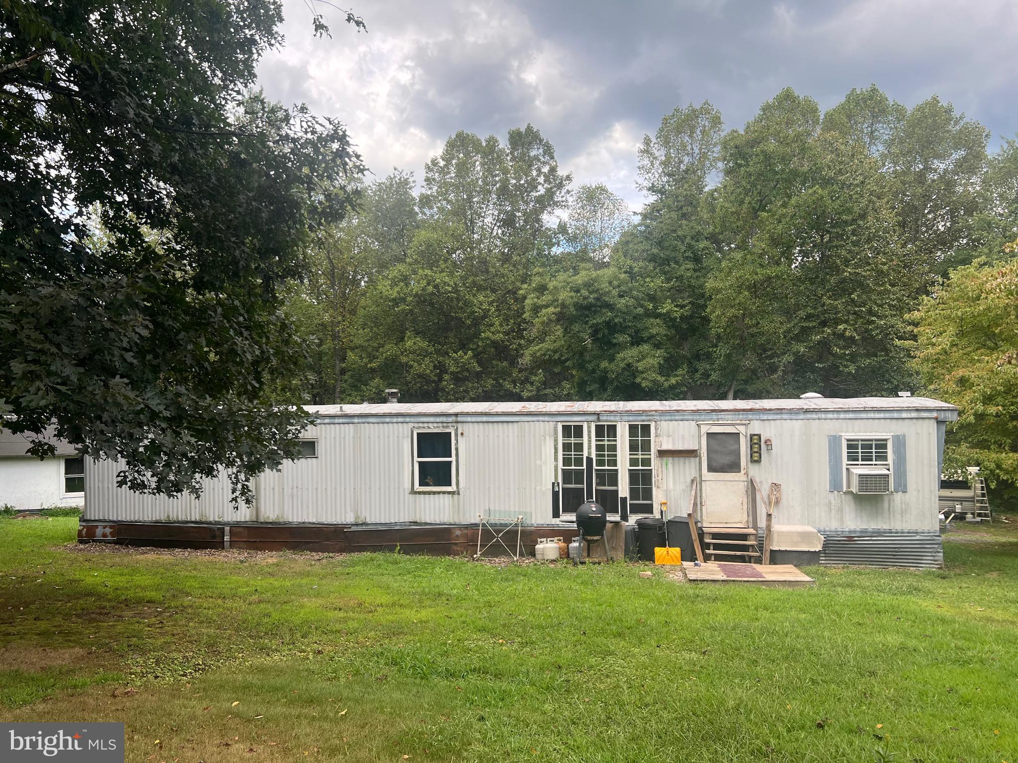 22322 Cacapon Road Paw Paw, WV 25434 - Photo 2 of 11 a house view with a garden space