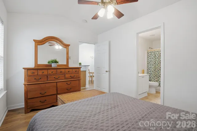 a bedroom with a bed and a dresser