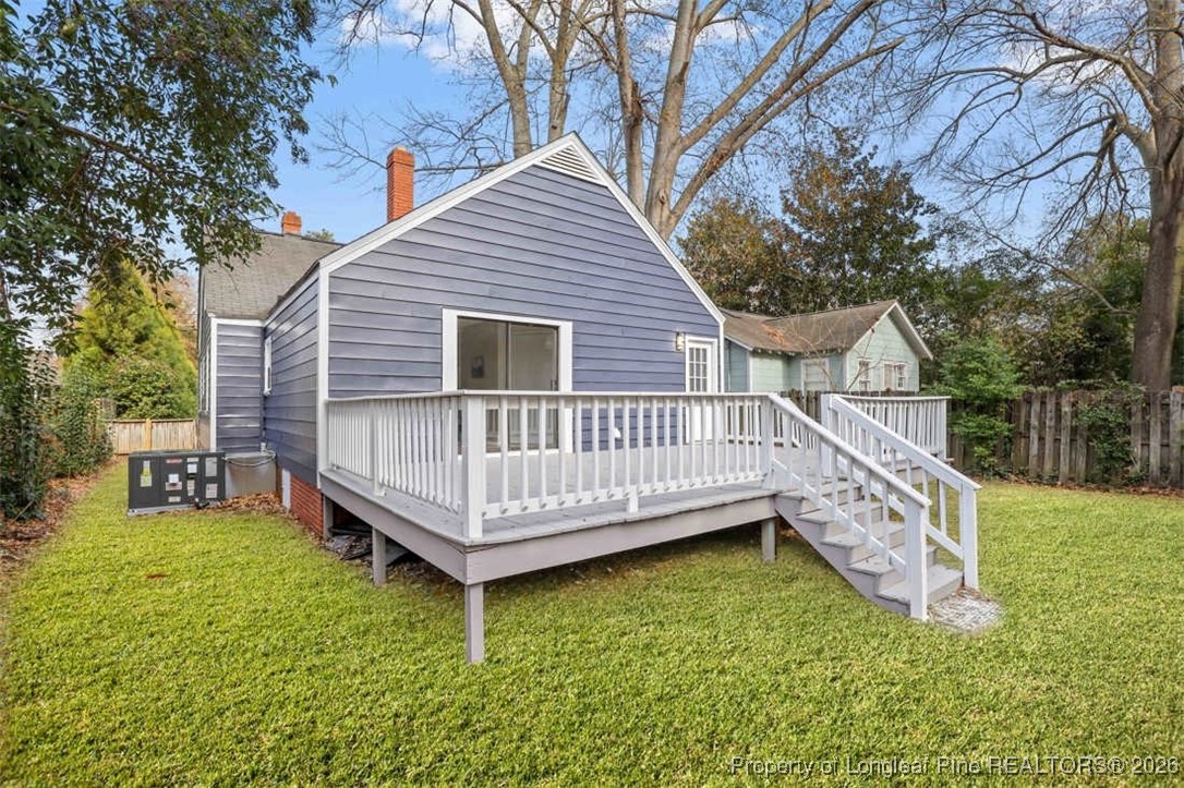 1605 Morganton Road Fayetteville, NC 28305 - Photo 29 of 30 a view of a house with a wooden deck and a yard