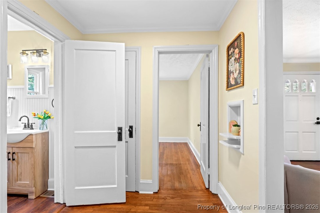 1605 Morganton Road Fayetteville, NC 28305 - Photo 8 of 30 a view of a hallway with closet and wooden floor