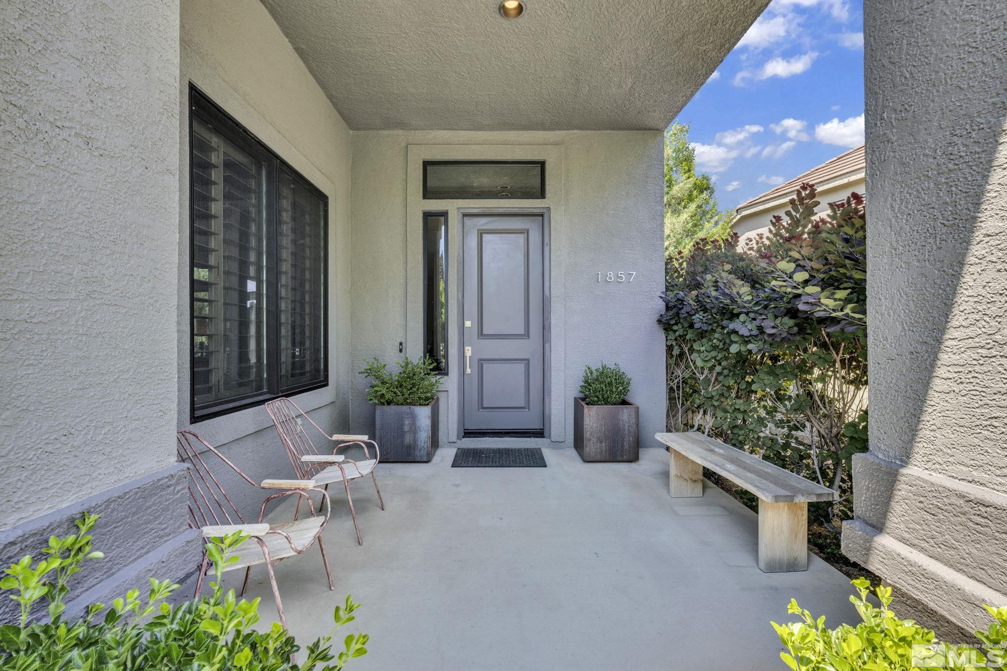 1857 Far Niente Court Reno, NV 89519 - Photo 3 of 37 a view of a porch with chairs and potted plants