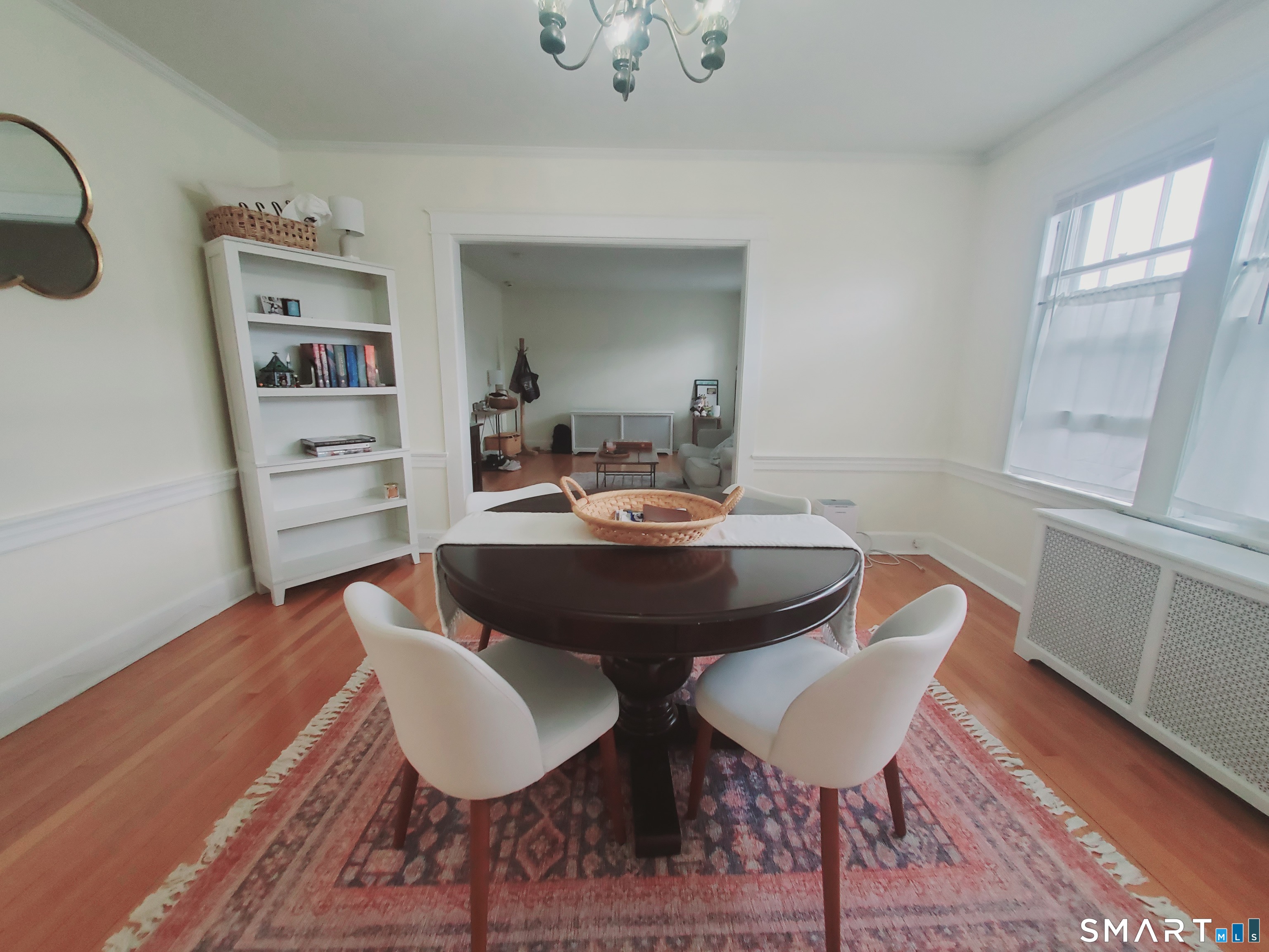 100 Colonial Road, Unit 2 Stamford, CT 06906 - Photo 3 of 8 a view of a dining room with furniture and wooden floor