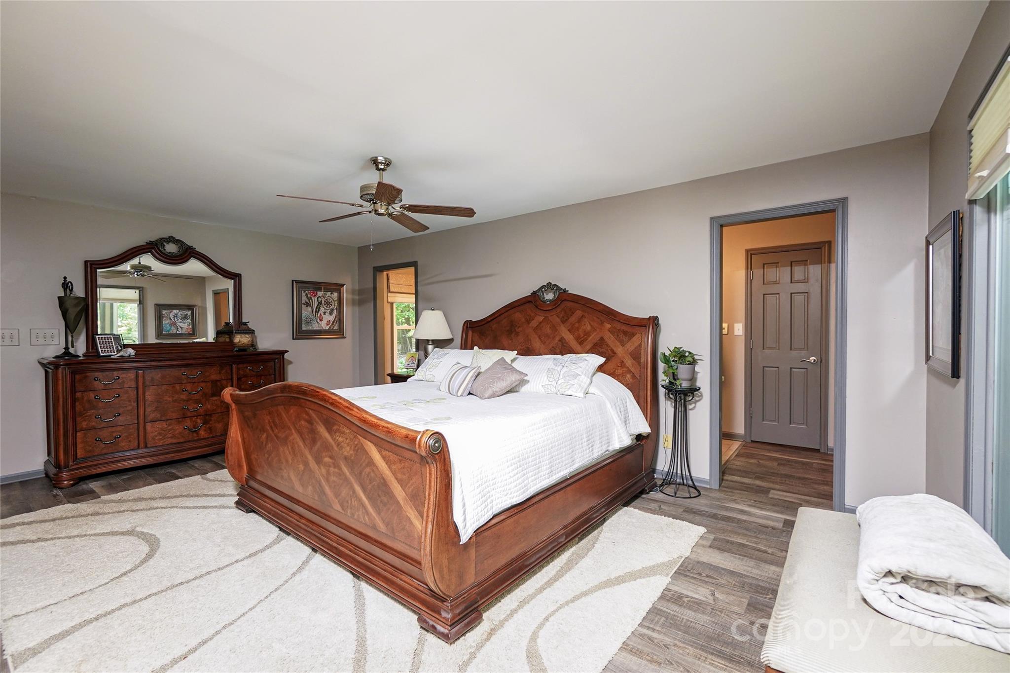 1115 John Short Road Indian Land, SC 29707 - Photo 17 of 48 a bedroom with a bed and a chandelier