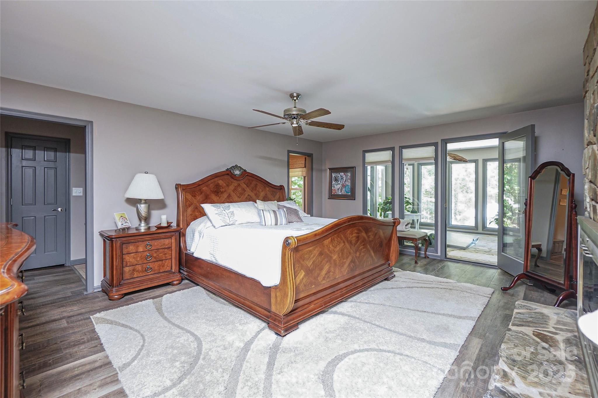 1115 John Short Road Indian Land, SC 29707 - Photo 18 of 48 a bedroom with a bed wooden floor and a table