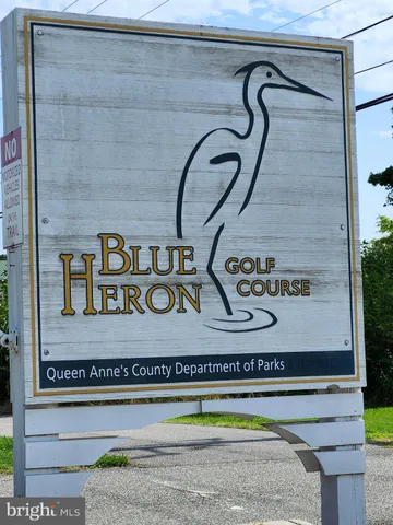 a view of a sign board with a lake view