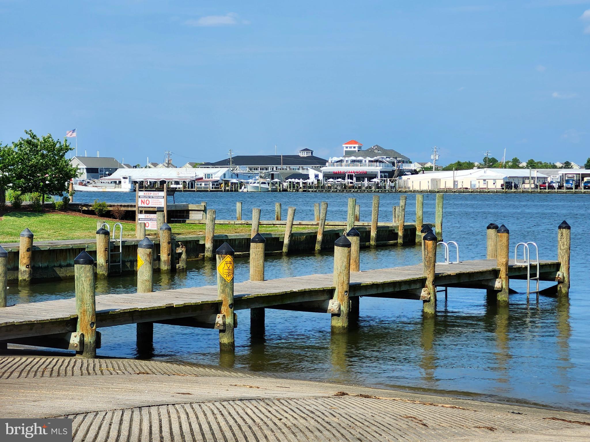 303 Queens Colony High Road Stevensville, MD 21666 - Photo 5 of 21 a view of a swimming pool with seating space