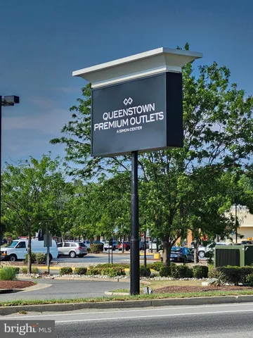 a sign broad in front of the red brick house