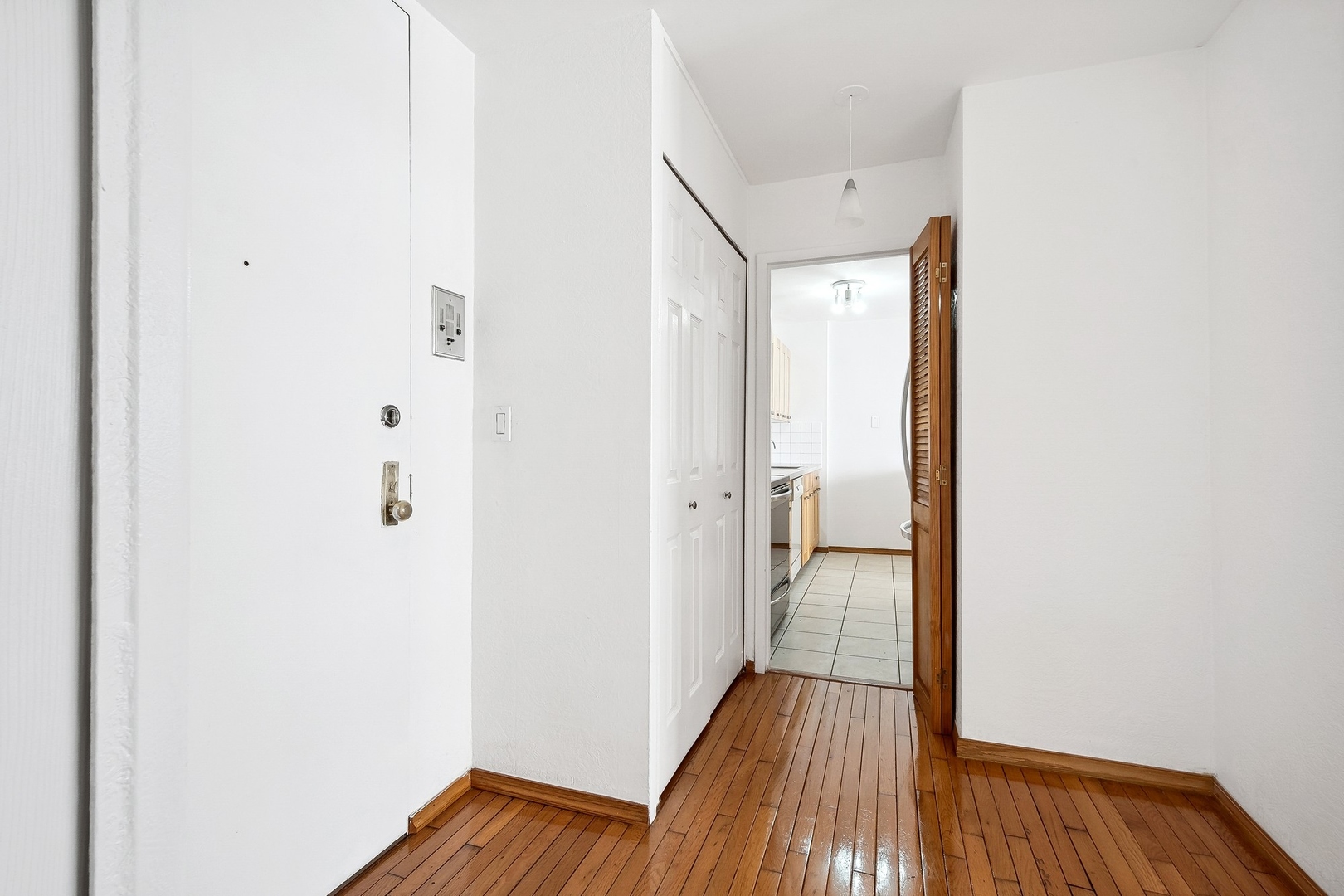 5701 North Sheridan Road, Unit 15R Chicago, IL 60660 - Photo 14 of 21 a view of a hallway with wooden floor