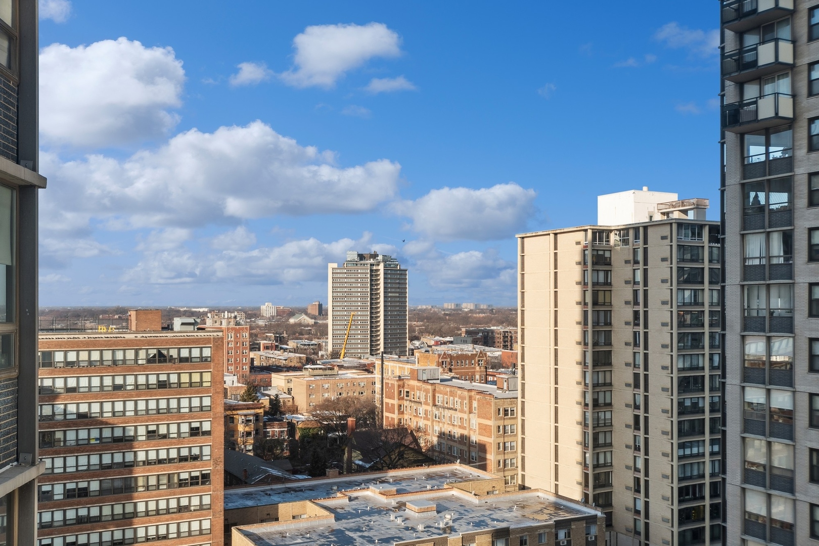 5701 North Sheridan Road, Unit 15R Chicago, IL 60660 - Photo 17 of 21 a view of a city with tall buildings