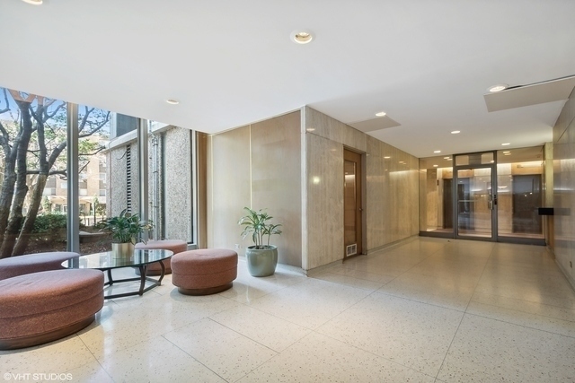 5701 North Sheridan Road, Unit 15R Chicago, IL 60660 - Photo 18 of 21 a lobby with furniture and floor to ceiling window