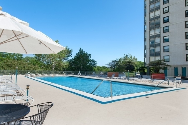 5701 North Sheridan Road, Unit 15R Chicago, IL 60660 - Photo 19 of 21 a view of a swimming pool with a lounge chair
