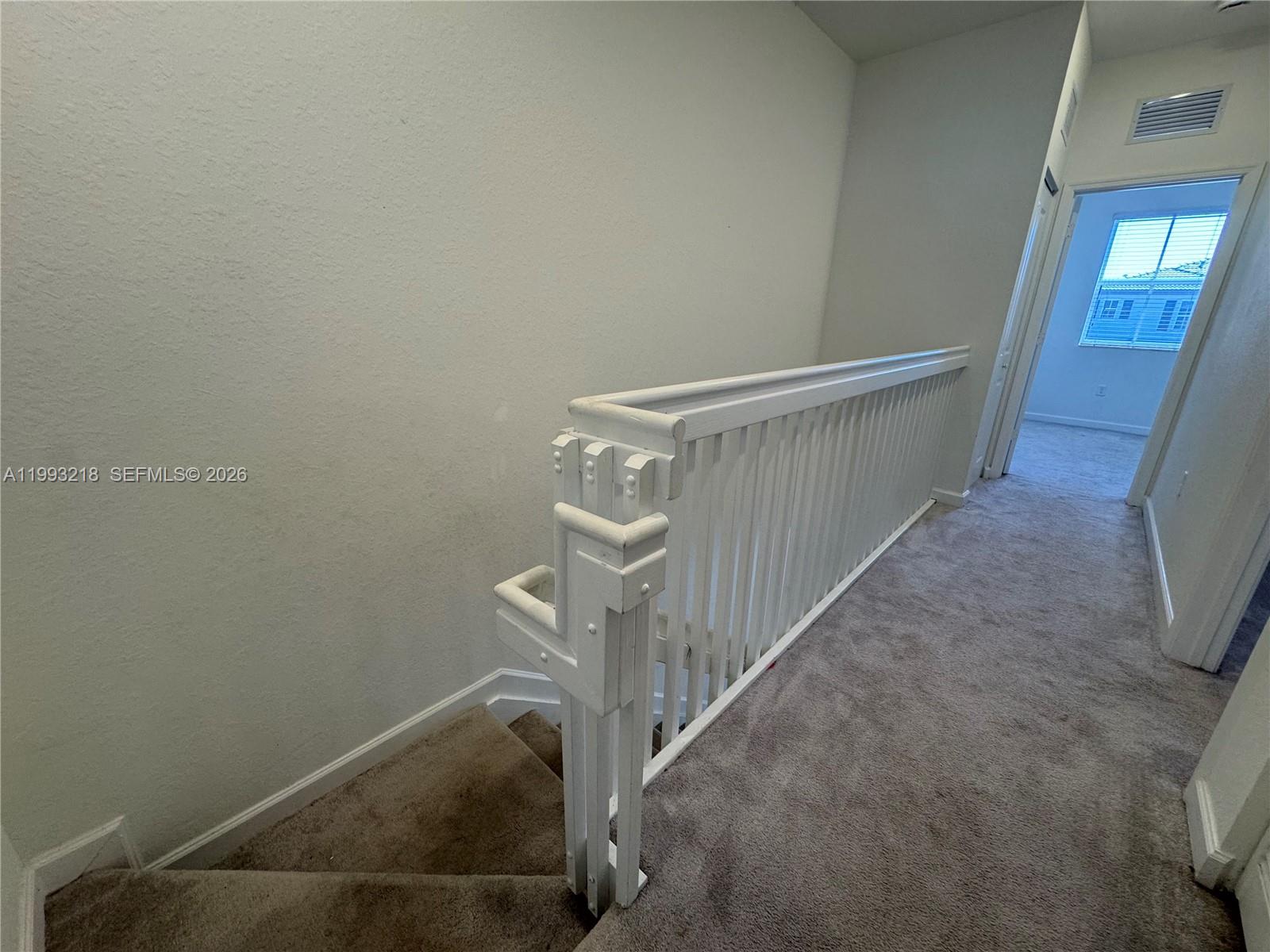 16227 Southwest 292nd Street Homestead, FL 33033 - Photo 13 of 28 a view of a hallway with staircase