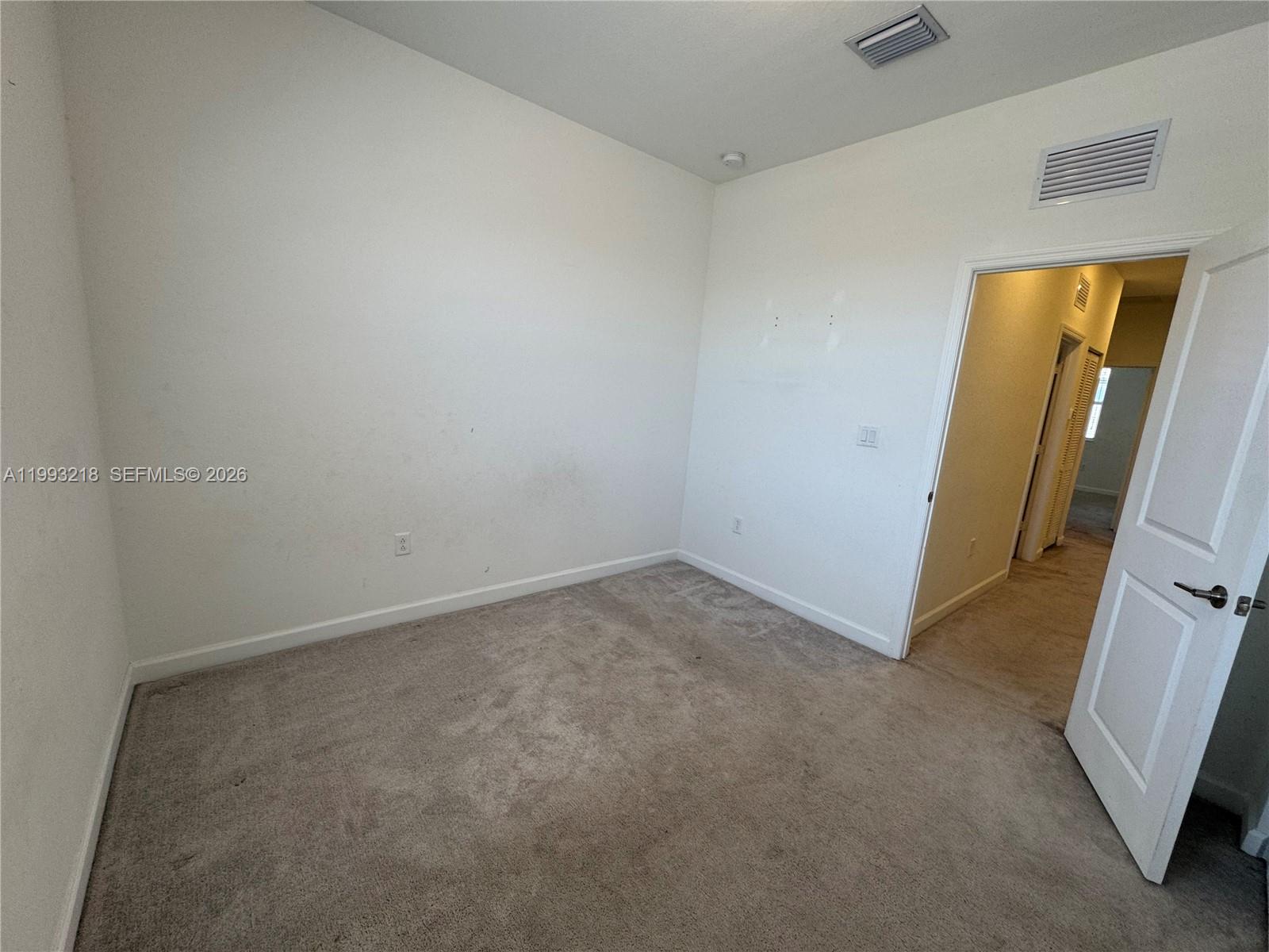 16227 Southwest 292nd Street Homestead, FL 33033 - Photo 19 of 28 an empty room with a mirror