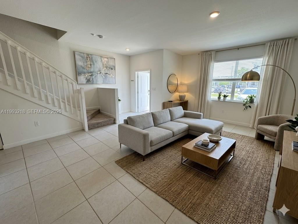 16227 Southwest 292nd Street Homestead, FL 33033 - Photo 2 of 28 a living room with furniture and a table