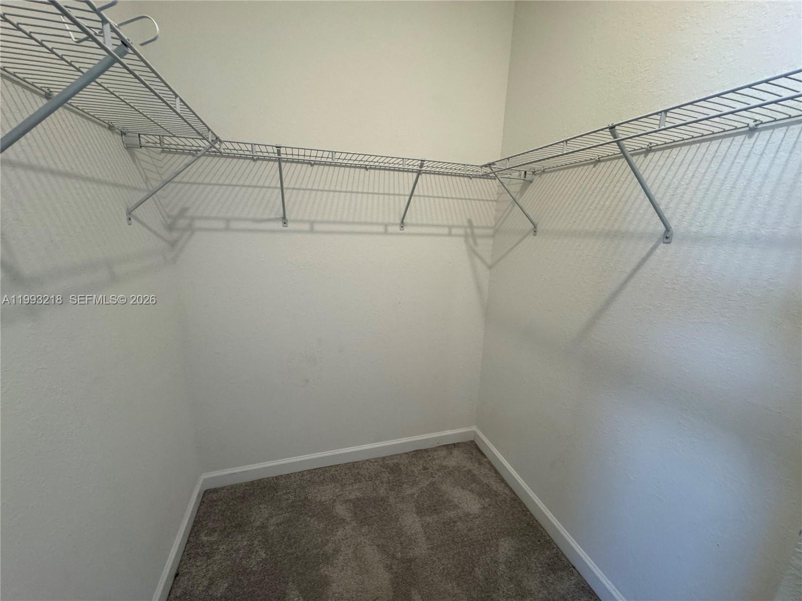 16227 Southwest 292nd Street Homestead, FL 33033 - Photo 26 of 28 a view of a room with racks on the wall