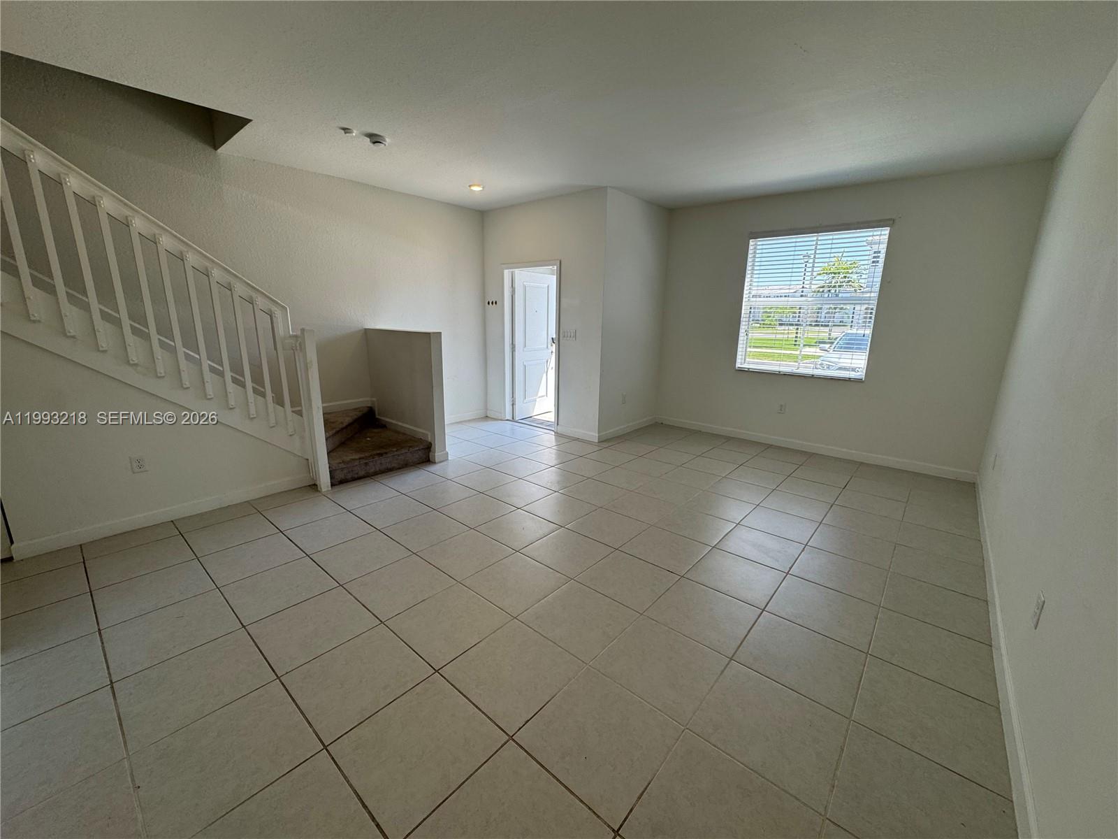 16227 Southwest 292nd Street Homestead, FL 33033 - Photo 3 of 28 a view of an empty room and window