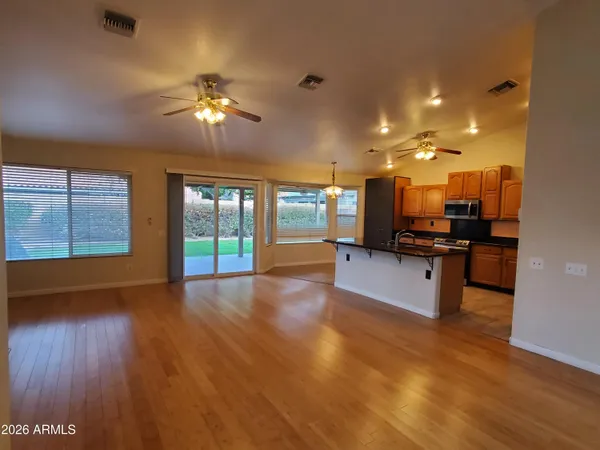 a view of kitchen with sink and wooden floor