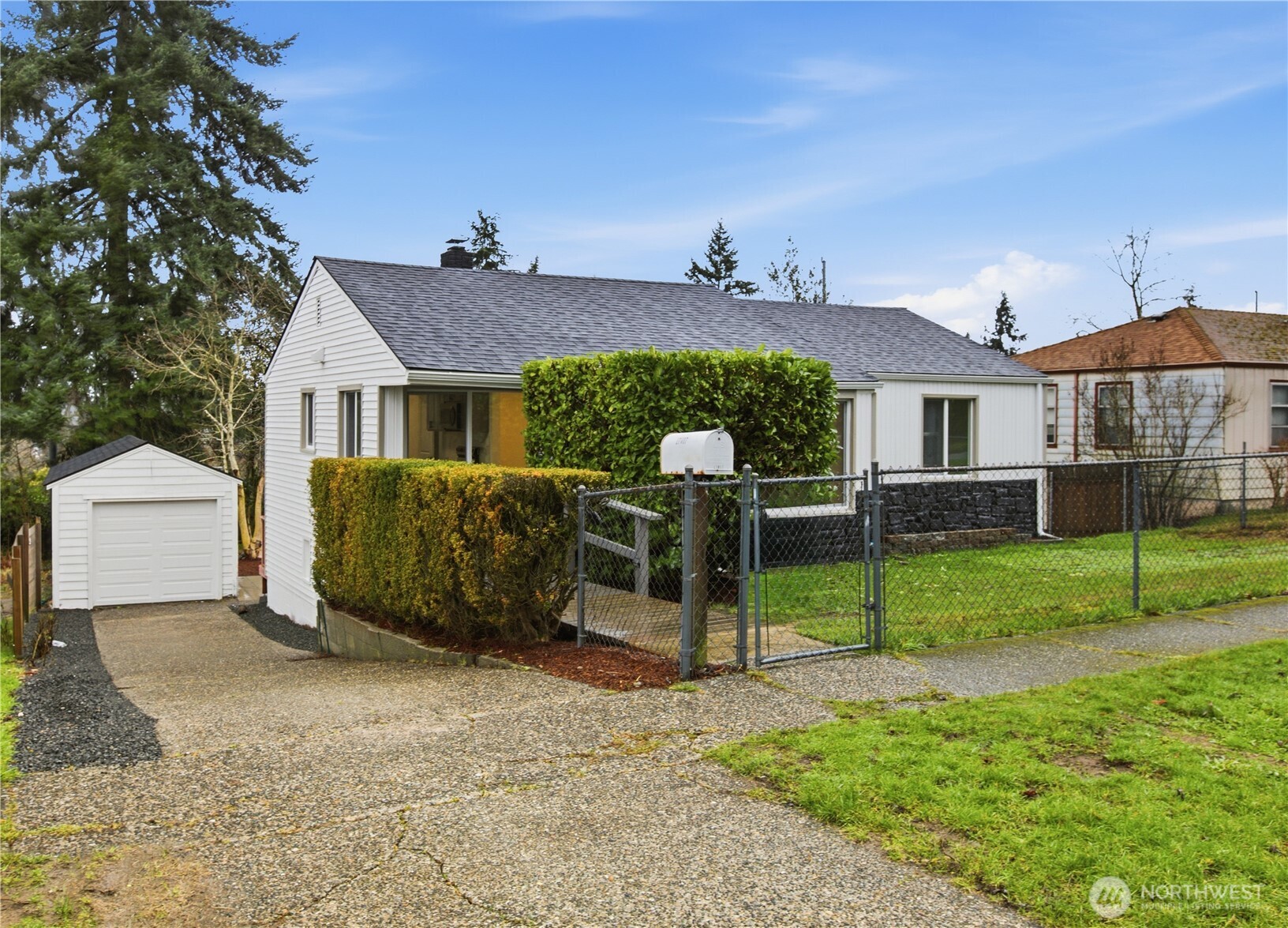 a view of a house with a yard and porch