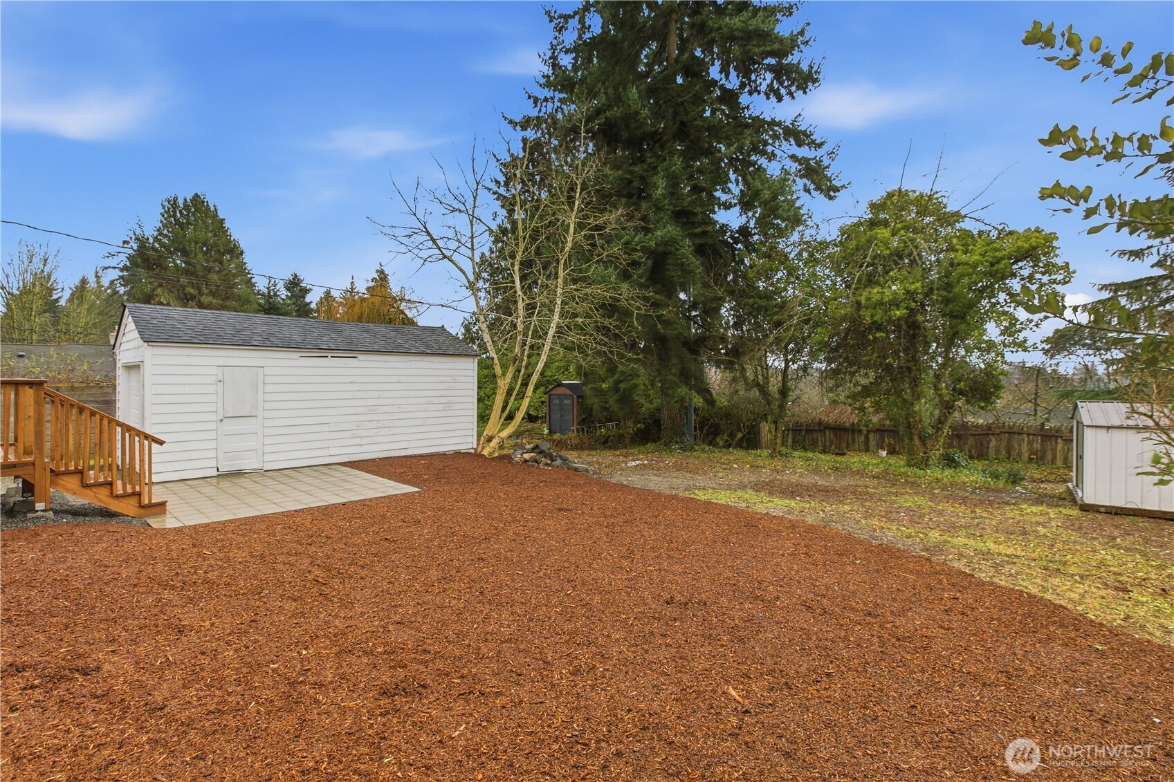 17017 4th Avenue Northeast Shoreline, WA 98155 - Photo 26 of 28 a view of backyard of house and trees