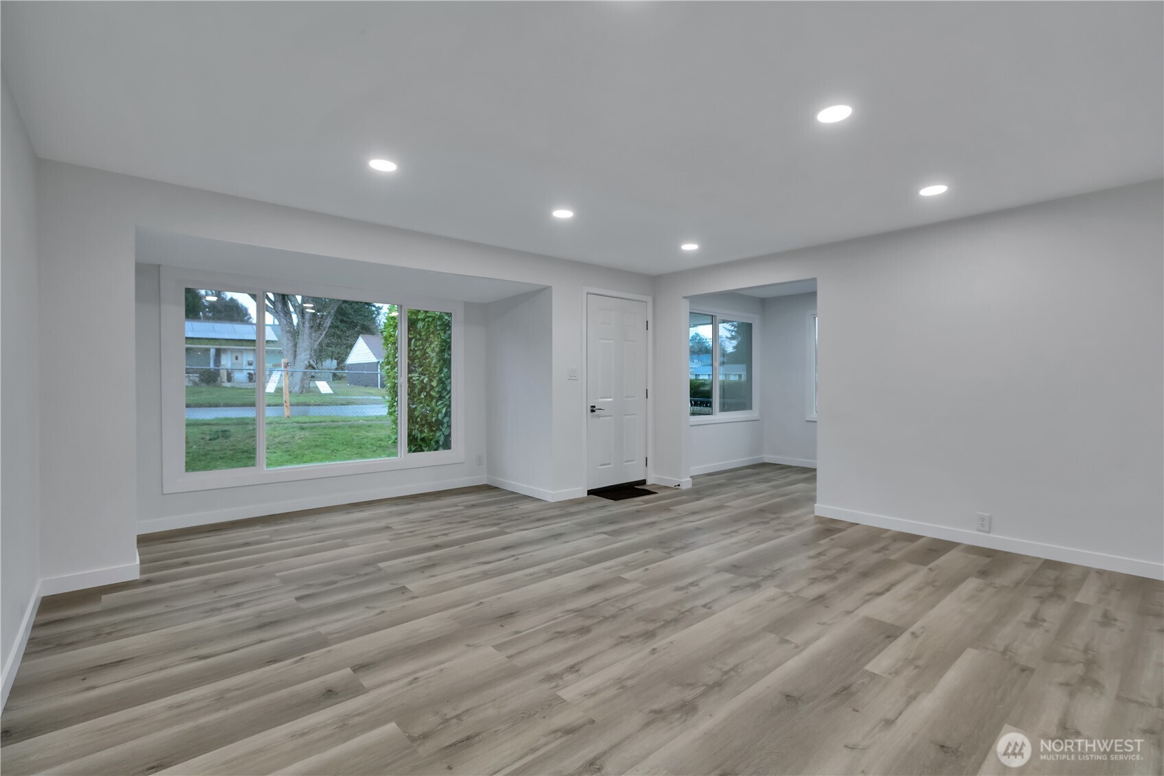 17017 4th Avenue Northeast Shoreline, WA 98155 - Photo 5 of 28 a view of empty room with wooden floor and fan