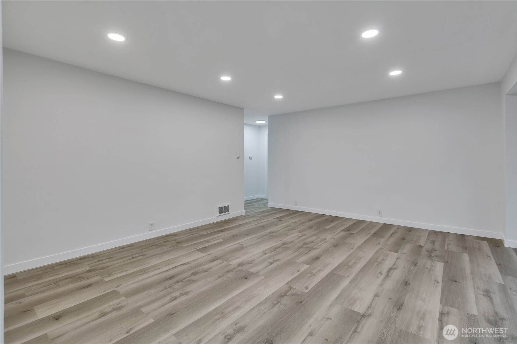 17017 4th Avenue Northeast Shoreline, WA 98155 - Photo 7 of 28 an empty room with wooden floor