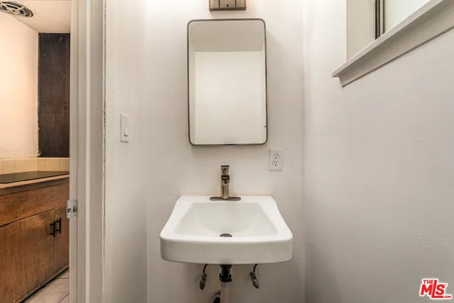 a bathroom with a sink and a mirror