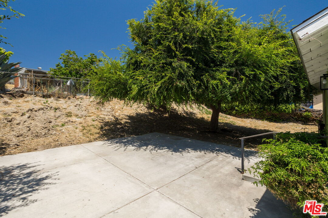 6352 Clyde Avenue San Diego, CA 92139 - Photo 25 of 30 a view of a yard with plants and trees