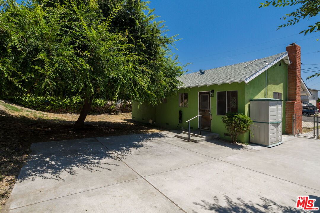 6352 Clyde Avenue San Diego, CA 92139 - Photo 26 of 30 a view of a house with a backyard