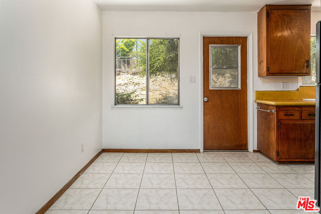6352 Clyde Avenue San Diego, CA 92139 - Photo 10 of 30 an empty room with window and bathroom