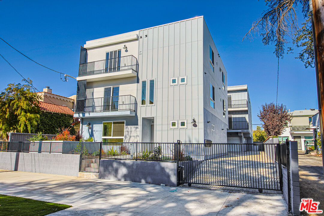 10803 Kling Street Toluca Lake, CA 91602 - Photo 2 of 25 a front view of a building with large glass windows
