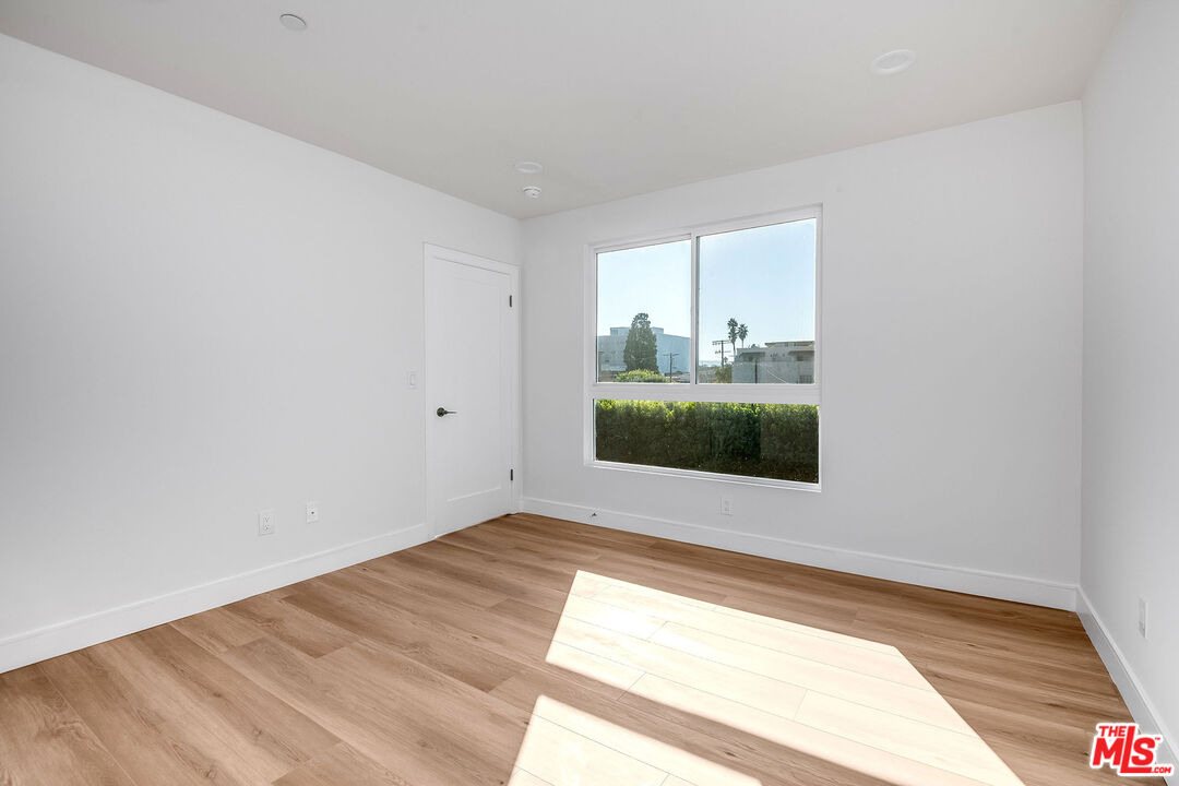 10803 Kling Street Toluca Lake, CA 91602 - Photo 23 of 25 a view of an empty room and window