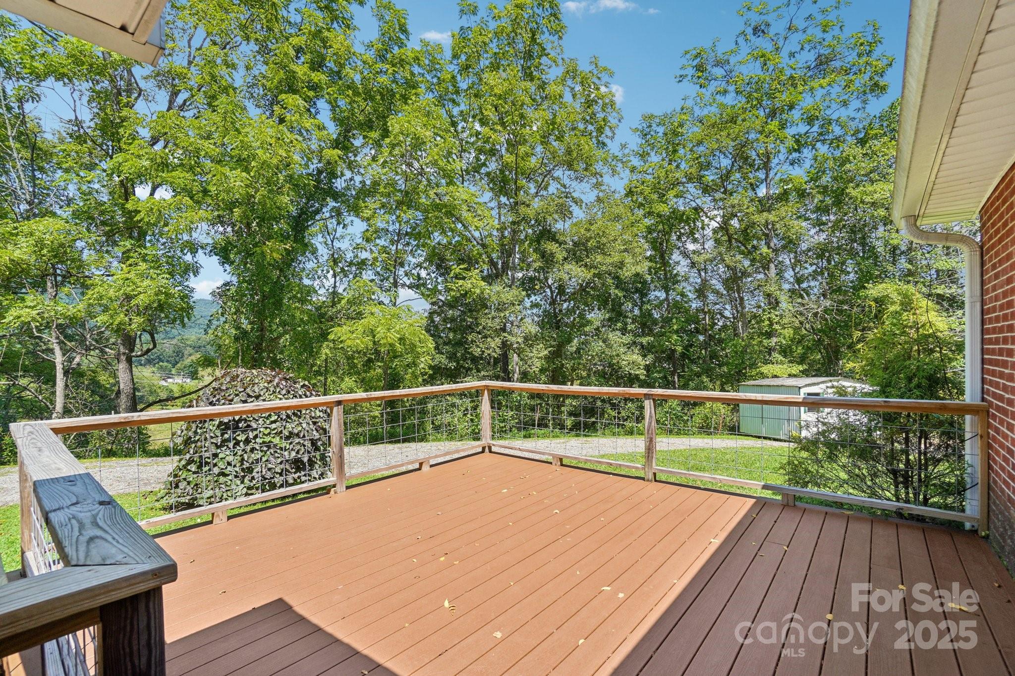 623 Edwards Cove Road Waynesville, NC 28786 - Photo 11 of 46 a view of a balcony with wooden floor