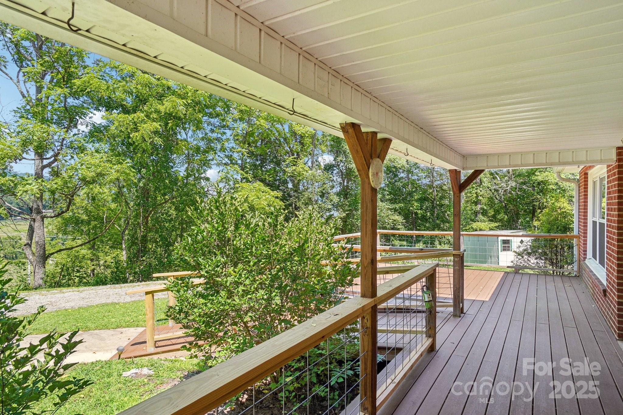 623 Edwards Cove Road Waynesville, NC 28786 - Photo 13 of 46 a view of balcony with wooden floor