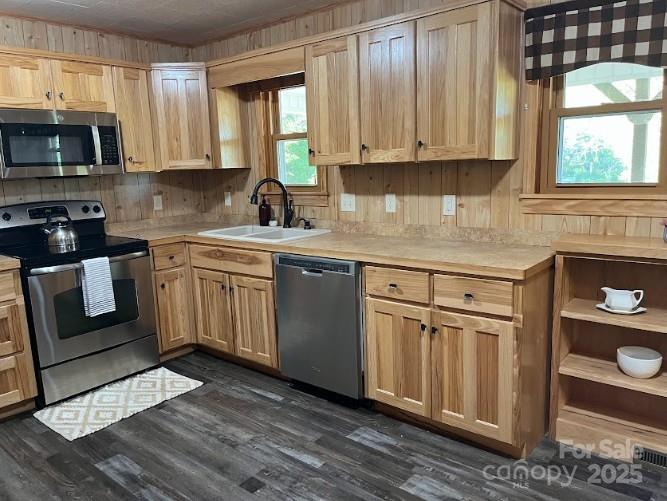 623 Edwards Cove Road Waynesville, NC 28786 - Photo 14 of 46 a kitchen with stainless steel appliances granite countertop a stove a sink and a microwave