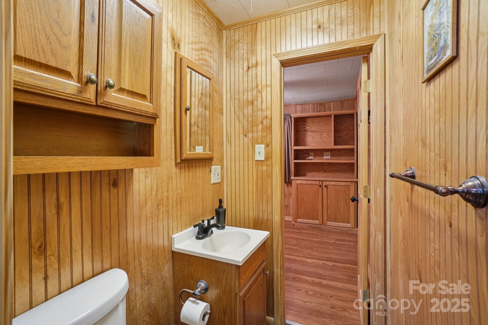 623 Edwards Cove Road Waynesville, NC 28786 - Photo 20 of 46 a bathroom with a sink a toilet and shower